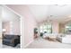 Bright living room with a sofa, neutral decor, and ample natural light from large windows at 10321 Ravines Dr, New Port Richey, FL 34654