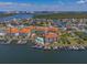 Aerial view of condos, community pool, and boat docks on the water at 1042 Bellasol Way # 202, Apollo Beach, FL 33572