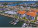 Impressive aerial view of the community with boat docks, waterfront buildings, and ample parking at 1042 Bellasol Way # 202, Apollo Beach, FL 33572