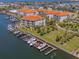 Scenic aerial view of the community's buildings, boat docks, and meticulously maintained grounds at 1042 Bellasol Way # 202, Apollo Beach, FL 33572