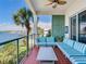 This delightful balcony features outdoor seating with stunning water views at 1042 Bellasol Way # 202, Apollo Beach, FL 33572