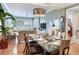 View of dining room flowing into the living room showcasing an open floor plan and stylish interior at 1042 Bellasol Way # 202, Apollo Beach, FL 33572