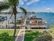 Picturesque dock with multiple boat slips on a sunny day with lush surroundings at 1042 Bellasol Way # 202, Apollo Beach, FL 33572