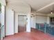 Building hallway with elevator access, ceramic tile floors, and outdoor seating at 1042 Bellasol Way # 202, Apollo Beach, FL 33572