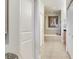 The ensuite bathroom features tile flooring, double closets, and a built-in bath at 1042 Bellasol Way # 202, Apollo Beach, FL 33572