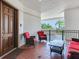 Cozy porch with comfortable seating, tiled floor, and pleasant outdoor view at 1042 Bellasol Way # 202, Apollo Beach, FL 33572