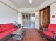 Relaxing outdoor porch with seating, table, and tiled flooring at 1042 Bellasol Way # 202, Apollo Beach, FL 33572