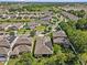 Residential neighborhood view featuring a home with solar panels, a fenced yard, and mature landscaping at 10514 Scenic Hollow Dr, Riverview, FL 33578