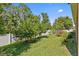 Spacious backyard with healthy green grass, trees and privacy fence at 10514 Scenic Hollow Dr, Riverview, FL 33578