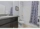 Bathroom features granite counters, stylish shower curtain and shower/tub combo at 10514 Scenic Hollow Dr, Riverview, FL 33578