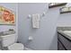 Powder room with granite counters, a toilet, and stylish decor at 10514 Scenic Hollow Dr, Riverview, FL 33578