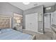 Comfortable bedroom with a plush bed, dresser, and ample closet space, offering a peaceful retreat at 10514 Scenic Hollow Dr, Riverview, FL 33578