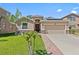 Charming single-story home with well-manicured lawn, stone accents, and a two-car garage at 10514 Scenic Hollow Dr, Riverview, FL 33578