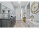 Stately foyer featuring a decorative console table and a large statement clock at 10514 Scenic Hollow Dr, Riverview, FL 33578