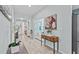 Light-filled hallway with tile flooring leading to various rooms and living spaces at 10514 Scenic Hollow Dr, Riverview, FL 33578
