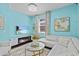 Stylish living room with a modern electric fireplace, a white sectional sofa, and chic decor for cozy relaxation at 10514 Scenic Hollow Dr, Riverview, FL 33578