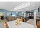 Open-concept living space with a modern kitchen, dining area, and a comfortable living room with a large sectional sofa at 10514 Scenic Hollow Dr, Riverview, FL 33578