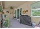 Enclosed patio with ceiling fan and a grill at 10514 Scenic Hollow Dr, Riverview, FL 33578