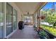 Enjoy the outdoors on this screened patio with ceiling fan and comfortable porch swing at 10514 Scenic Hollow Dr, Riverview, FL 33578