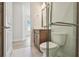 Well-lit bathroom featuring modern fixtures, a glass-enclosed shower, and a sleek vanity with a framed mirror at 10712 Oak Bend Dr, Parrish, FL 34219