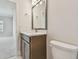 Well-lit bathroom featuring a modern vanity and toilet at 10712 Oak Bend Dr, Parrish, FL 34219