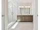 Modern bathroom featuring double sink vanity and glass shower at 10712 Oak Bend Dr, Parrish, FL 34219