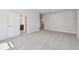 Large bedroom featuring two doors and carpeted floors at 10712 Oak Bend Dr, Parrish, FL 34219
