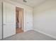 Comfortable bedroom with carpeted floors, neutral walls, and ample closet space at 10712 Oak Bend Dr, Parrish, FL 34219