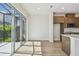 Sunny dining area with sliding glass doors leading to an outdoor patio and a view of the backyard at 10712 Oak Bend Dr, Parrish, FL 34219