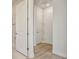 Hallway with white doors and trim, seamlessly connecting different areas of the home at 10712 Oak Bend Dr, Parrish, FL 34219