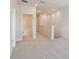 Hallway with open bathroom featuring neutral paint and plush carpet at 10712 Oak Bend Dr, Parrish, FL 34219