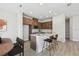 Modern kitchen featuring a center island with bar seating, stainless appliances, and ample cabinet space at 10712 Oak Bend Dr, Parrish, FL 34219