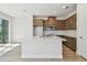 Modern kitchen with stainless steel appliances, white countertops, and wood cabinets at 10712 Oak Bend Dr, Parrish, FL 34219
