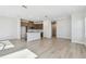 Open concept kitchen with stainless steel appliances, wood cabinetry, and island at 10712 Oak Bend Dr, Parrish, FL 34219