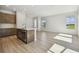 Open floor plan featuring a kitchen with stainless steel appliances and a living space with natural light at 10712 Oak Bend Dr, Parrish, FL 34219