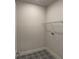 Tiled laundry room featuring mosaic tile and wire shelving at 10712 Oak Bend Dr, Parrish, FL 34219