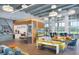 Bright community clubhouse lounge area with modern furniture and natural light at 10712 Oak Bend Dr, Parrish, FL 34219