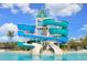 Community pool slide and tower with two slide exits and blue and white coloring at 10712 Oak Bend Dr, Parrish, FL 34219