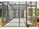 View from a screened-in patio featuring access to the home and a view of the backyard at 10712 Oak Bend Dr, Parrish, FL 34219