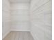 Spacious walk-in closet offering ample storage space with white, installed shelving units and carpeted floor at 10712 Oak Bend Dr, Parrish, FL 34219