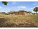 Expansive backyard offering ample space and features a screened in patio with the house at 11296 Warm Wind Way, Weeki Wachee, FL 34613