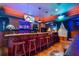 Charming bar area complete with seating, bar table and wine racks perfect for hosting parties at 11296 Warm Wind Way, Weeki Wachee, FL 34613