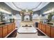 Bathroom with a central soaking tub, dual vanities, and decorative mirrors at 11296 Warm Wind Way, Weeki Wachee, FL 34613