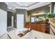Bathroom with a soaking tub, vanity, and large mirror at 11296 Warm Wind Way, Weeki Wachee, FL 34613