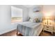 Cozy bedroom featuring a comfortable bed, stylish decor, and a bright window at 11296 Warm Wind Way, Weeki Wachee, FL 34613