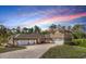 Stunning two-story home with a brick driveway and a three-car garage, offering ample parking and curb appeal at 11296 Warm Wind Way, Weeki Wachee, FL 34613
