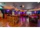 Spacious entertainment room with pool table, multiple tables and seating, and a projector screen at 11296 Warm Wind Way, Weeki Wachee, FL 34613