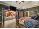 Main bedroom showcasing access to an outdoor pool area and a sitting area at 11296 Warm Wind Way, Weeki Wachee, FL 34613