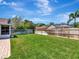 Lush green backyard with a brick patio area perfect for relaxing and entertaining outdoors at 12327 Glenfield Ave, Tampa, FL 33626