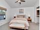 Bedroom with neutral decor, a ceiling fan, and a window with a view of the outdoors at 12327 Glenfield Ave, Tampa, FL 33626